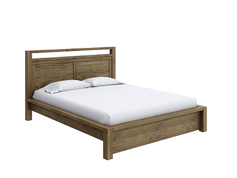 Коричневая кровать Fiord - Кровать из массива с декоративной резкой в изголовье.